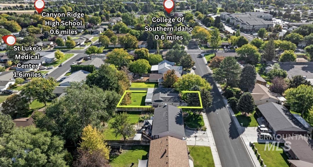 Aerial perspective of suburban area featuring property boundaries highlighted