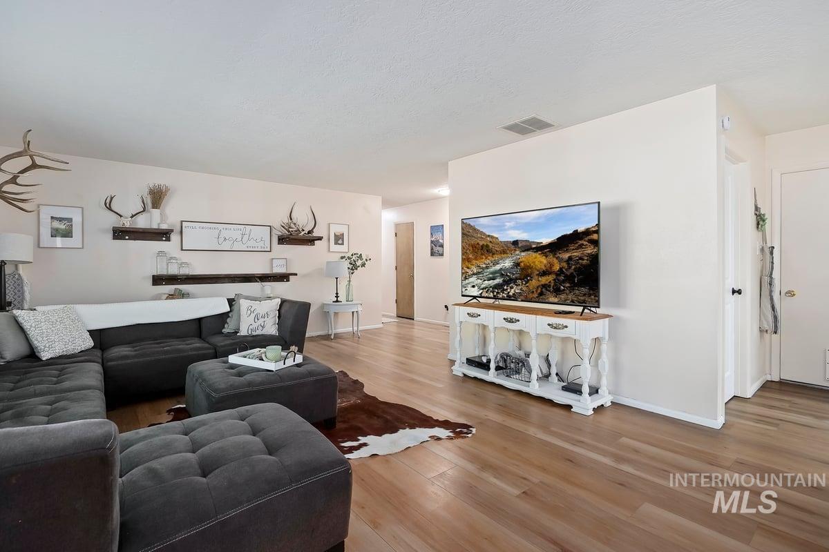 Living area featuring wood finished floors and baseboards