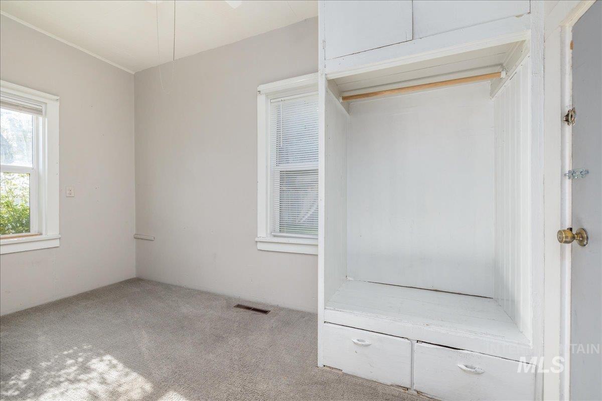 Unfurnished bedroom featuring carpet