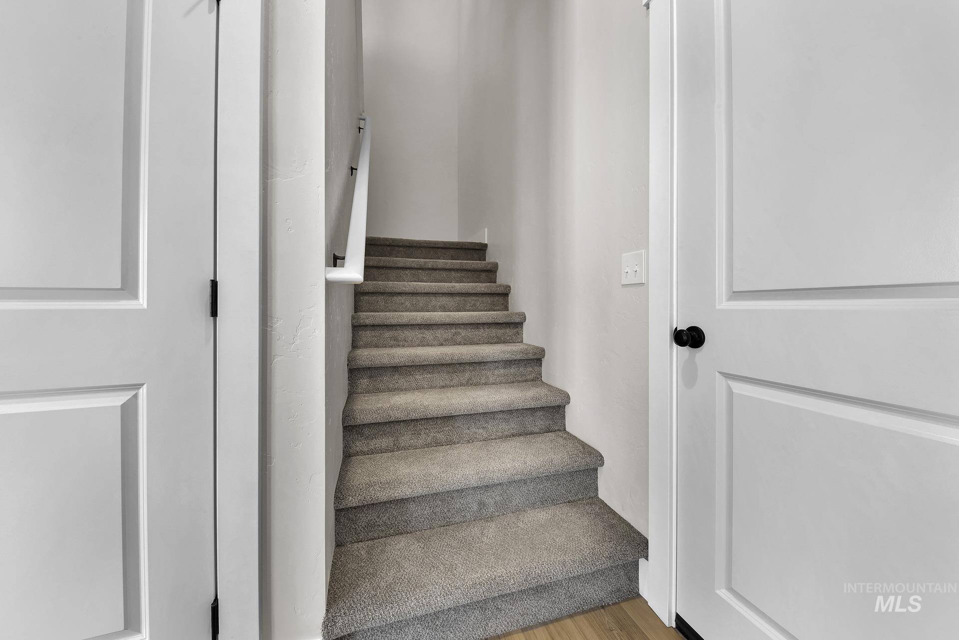 Staircase with wood finished floors
