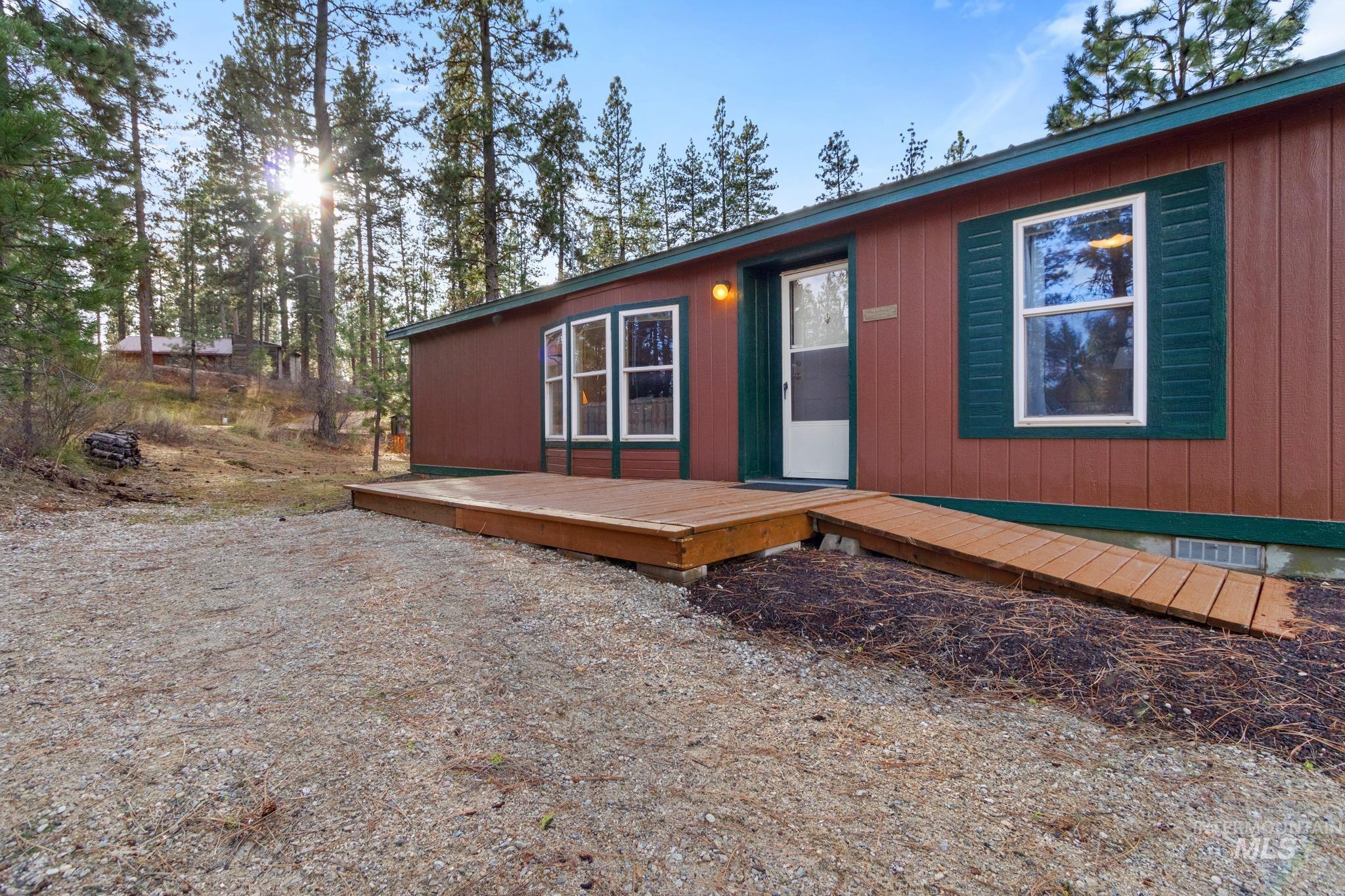 Chalet / cabin featuring a wooden deck