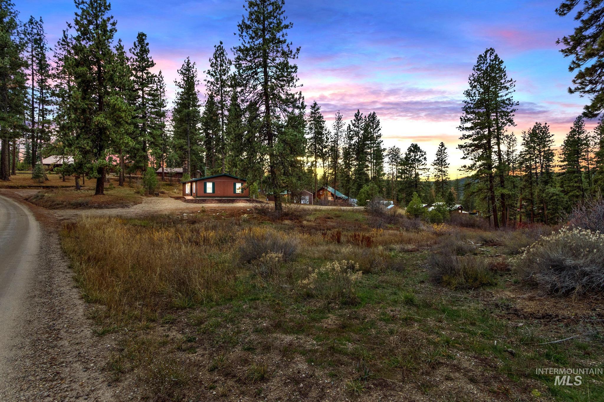 Yard at dusk featuring a playground