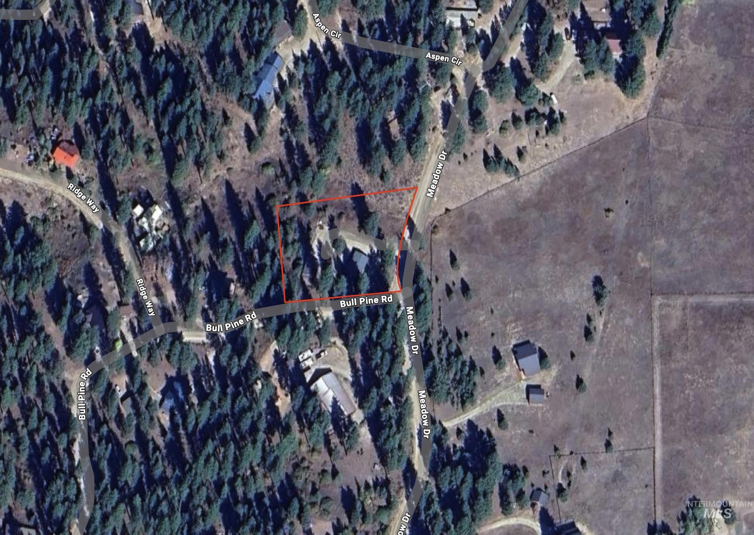 Aerial overview of property's location with property parcel outlined
