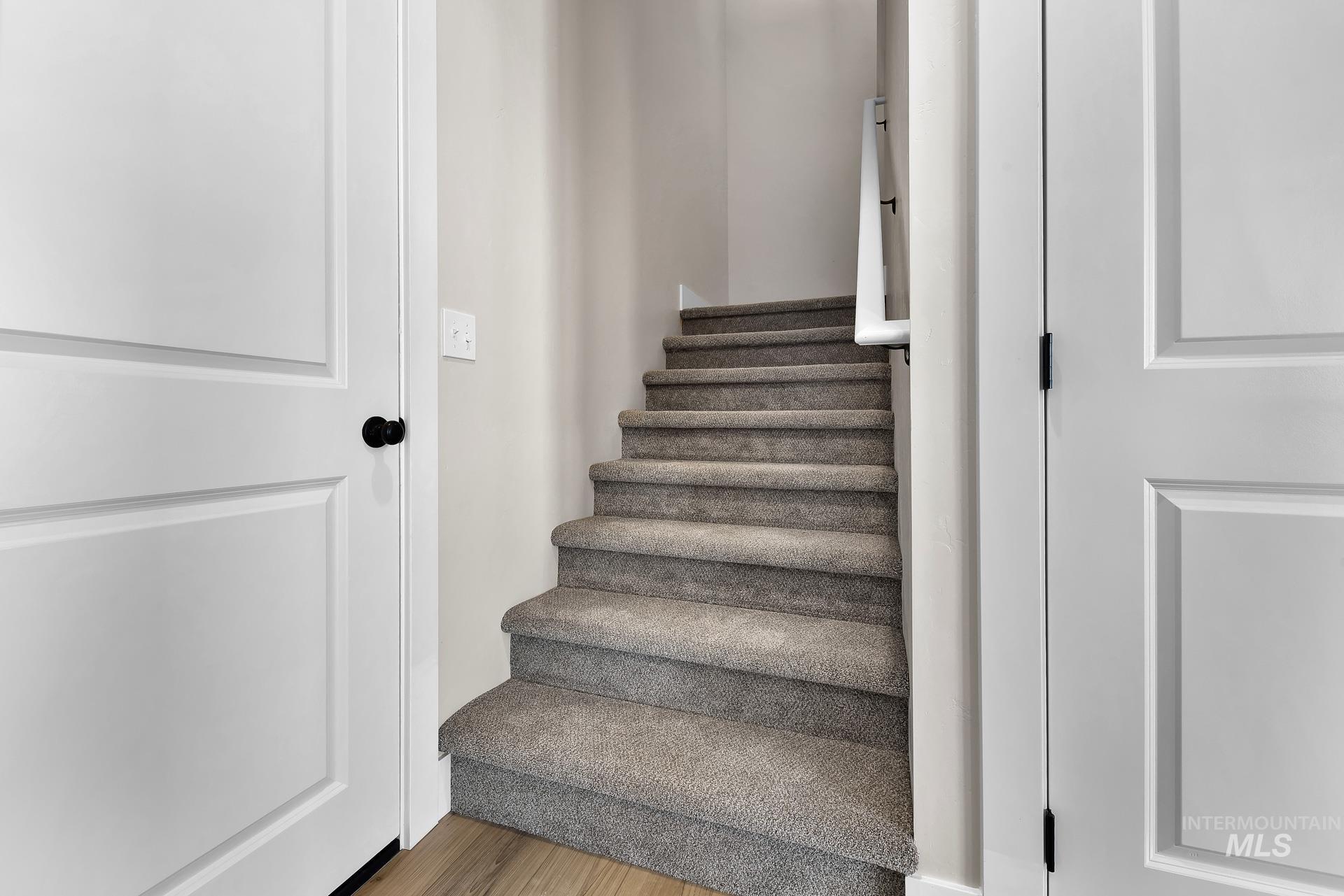 Staircase with wood finished floors