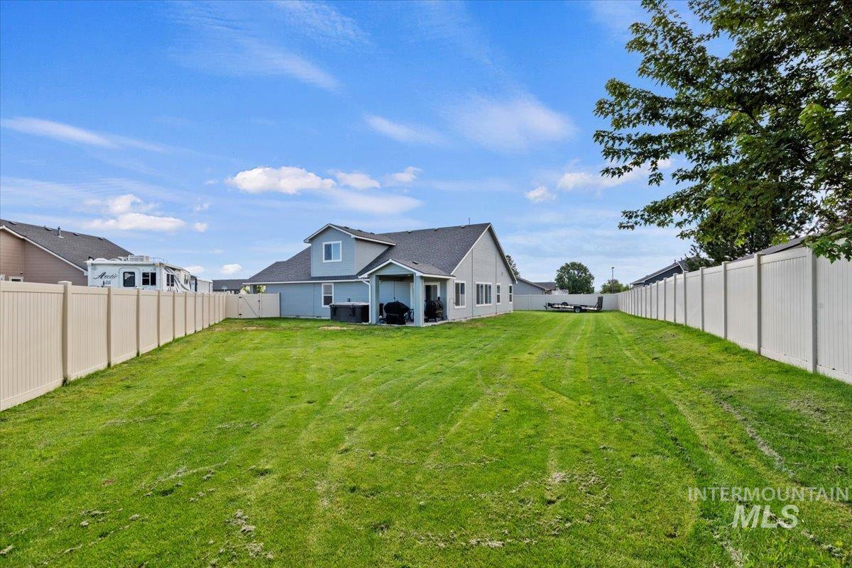 Back of house featuring a fenced backyard