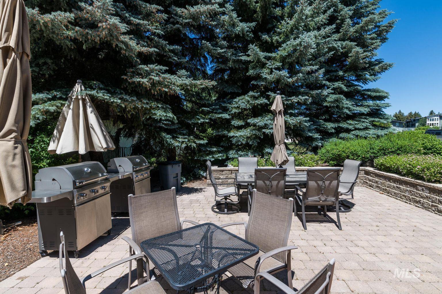 View of patio featuring outdoor dining area and grilling area