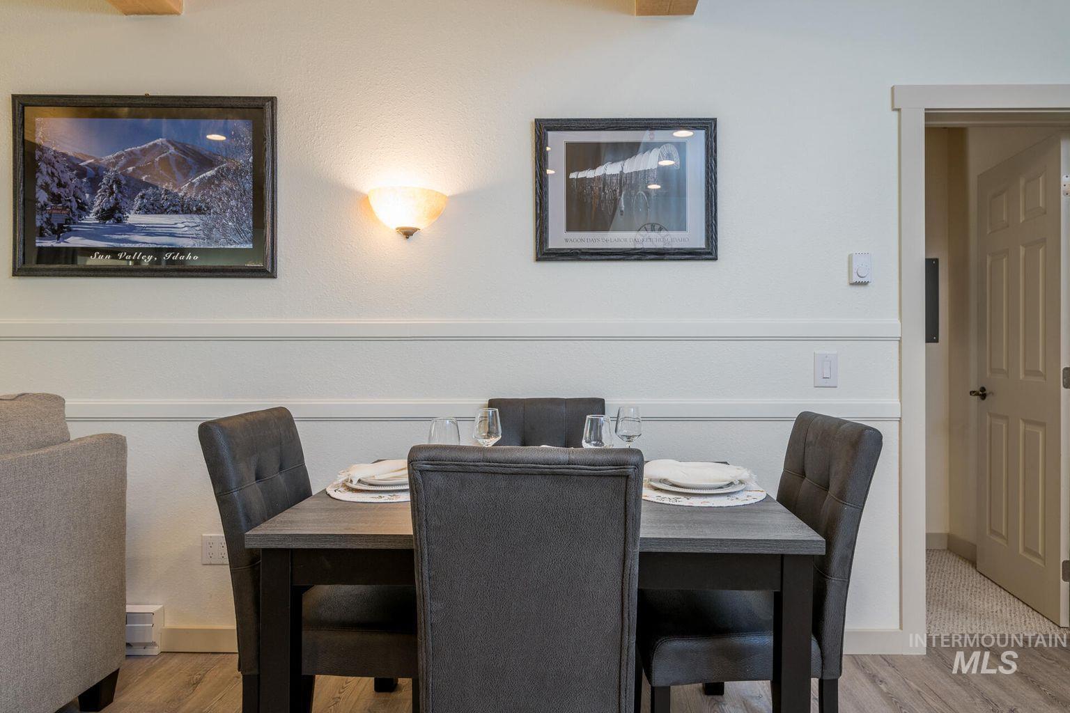 Dining space with wood finished floors