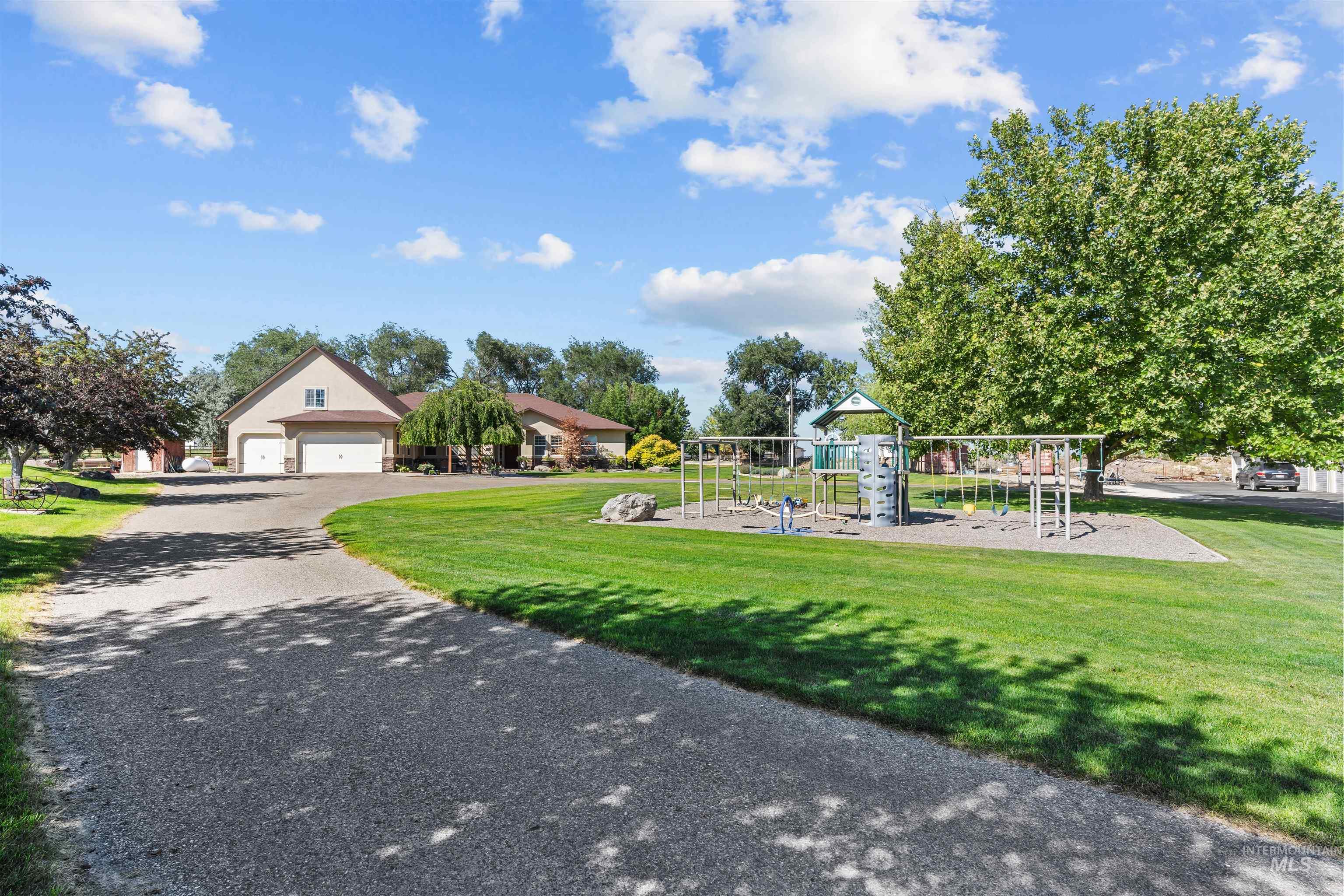 View of front of house with a front yard and driveway
