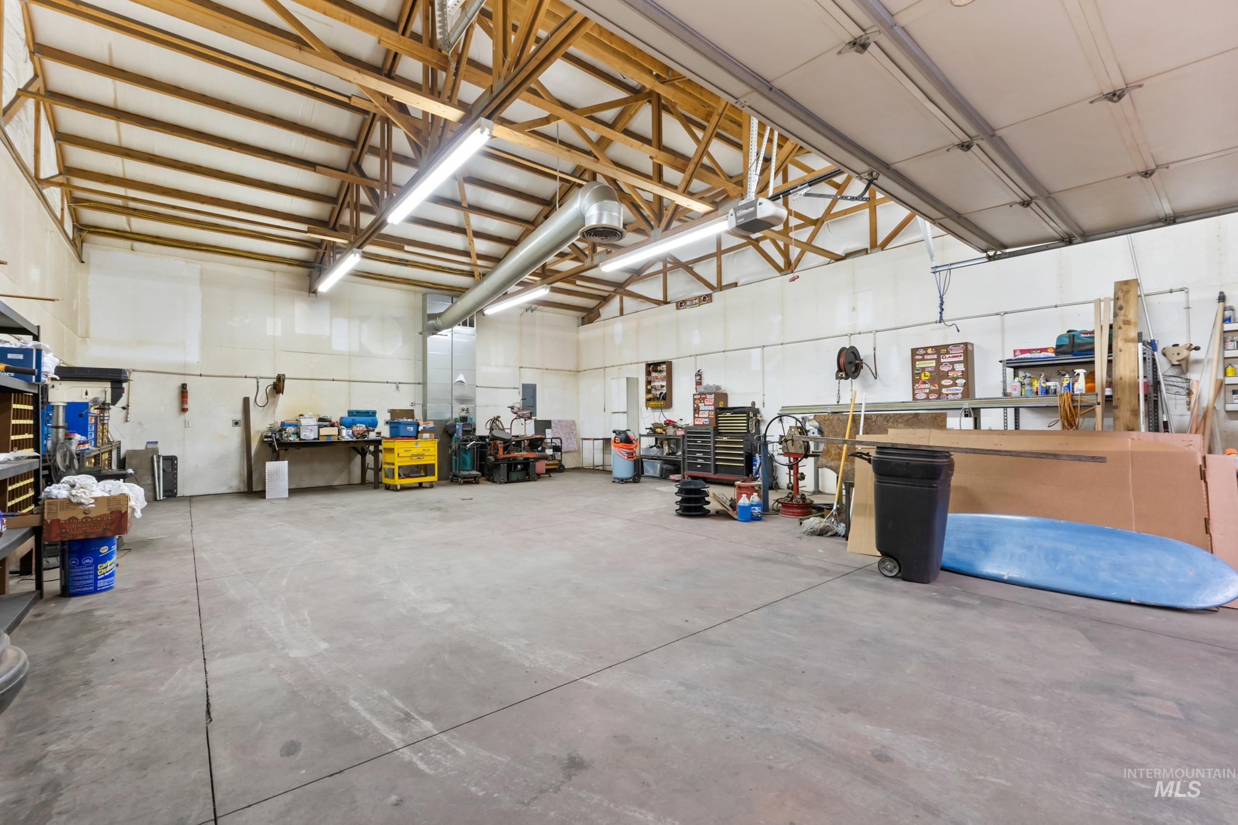 Garage with a workshop area and a garage door opener