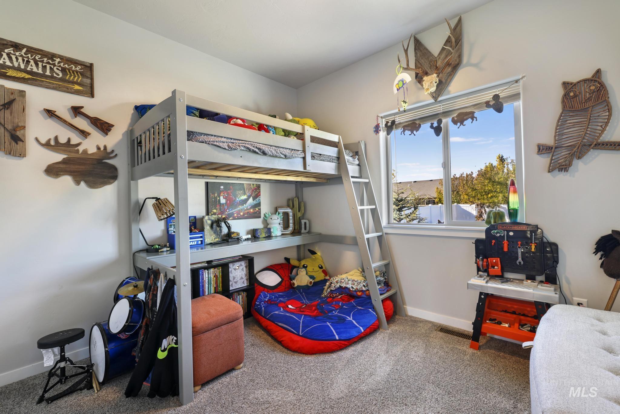 Carpeted bedroom with baseboards