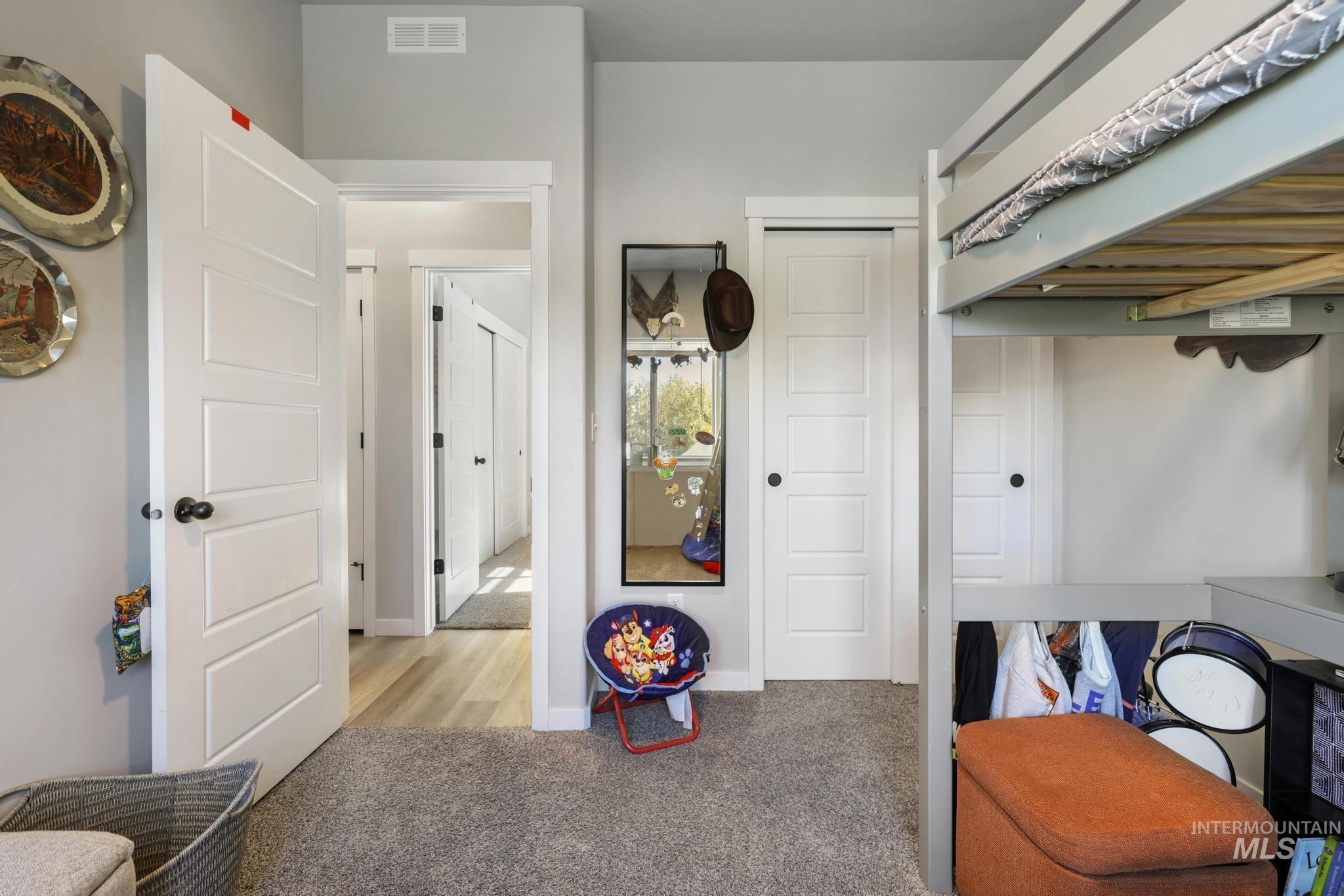 Interior space featuring light carpet and baseboards