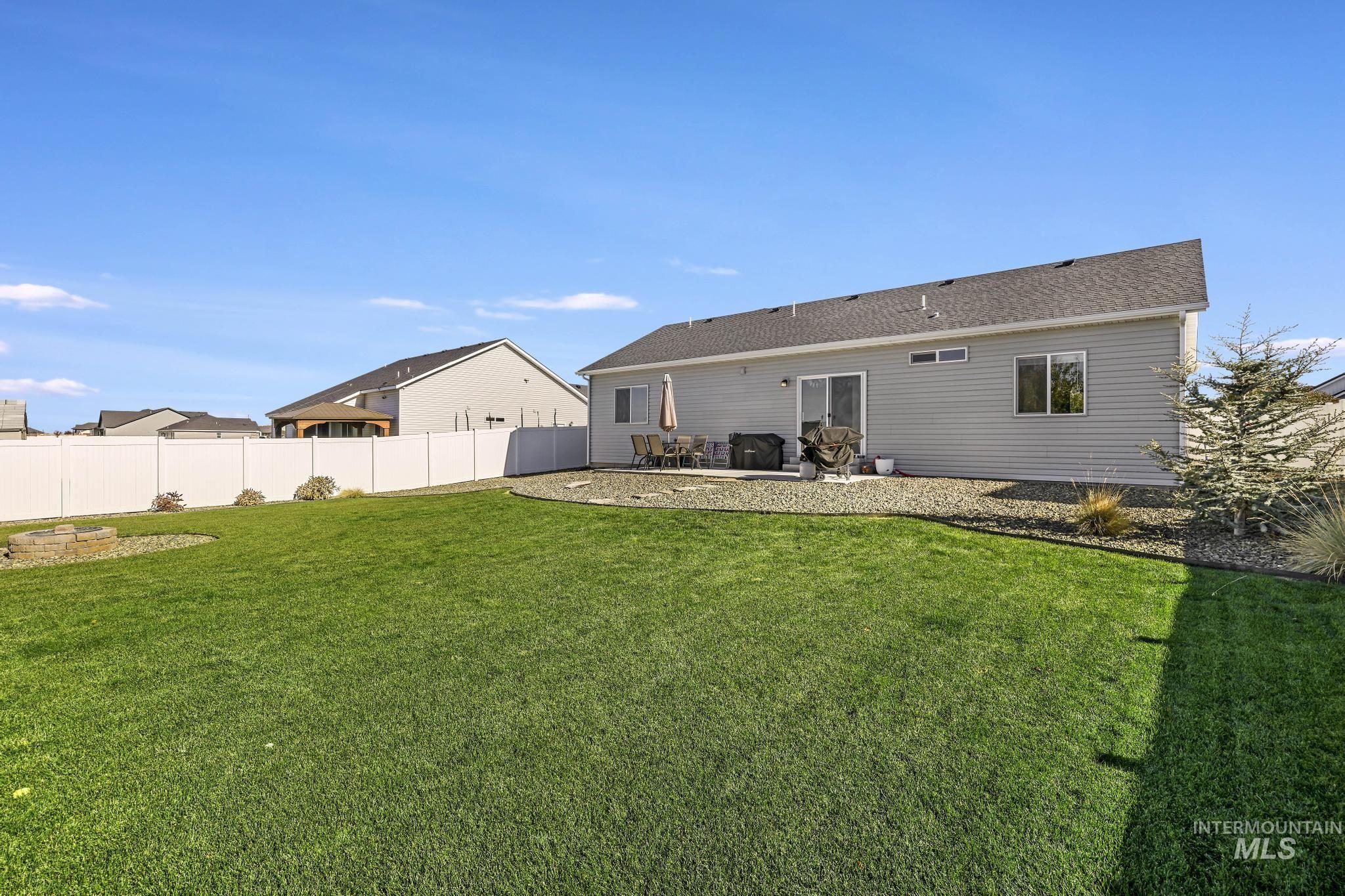 Back of house with a patio area