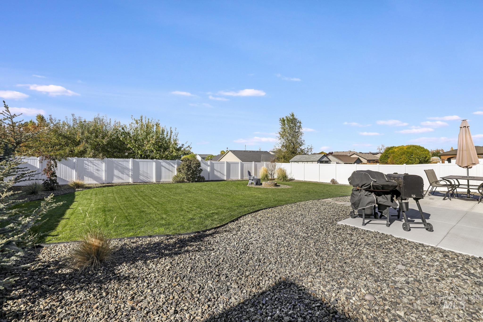 Fenced backyard featuring a patio area