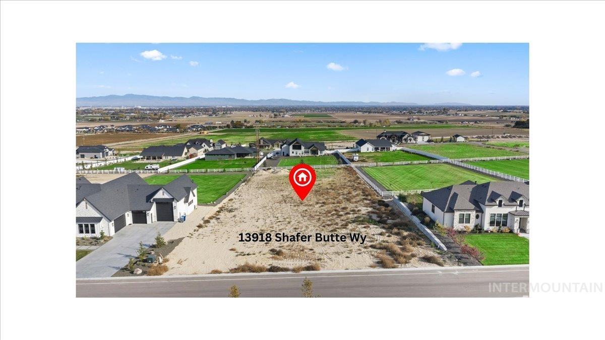 Aerial perspective of suburban area featuring a mountain backdrop