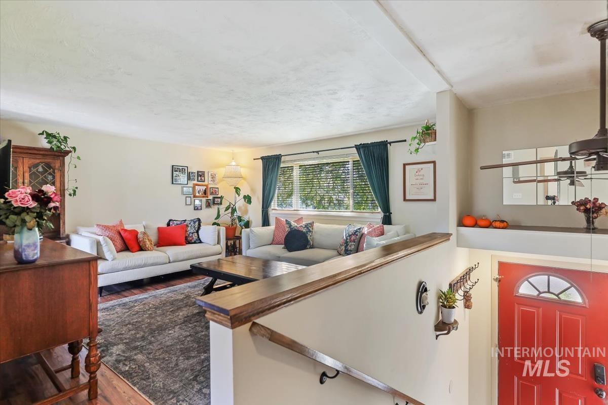 Living area featuring dark wood-style flooring