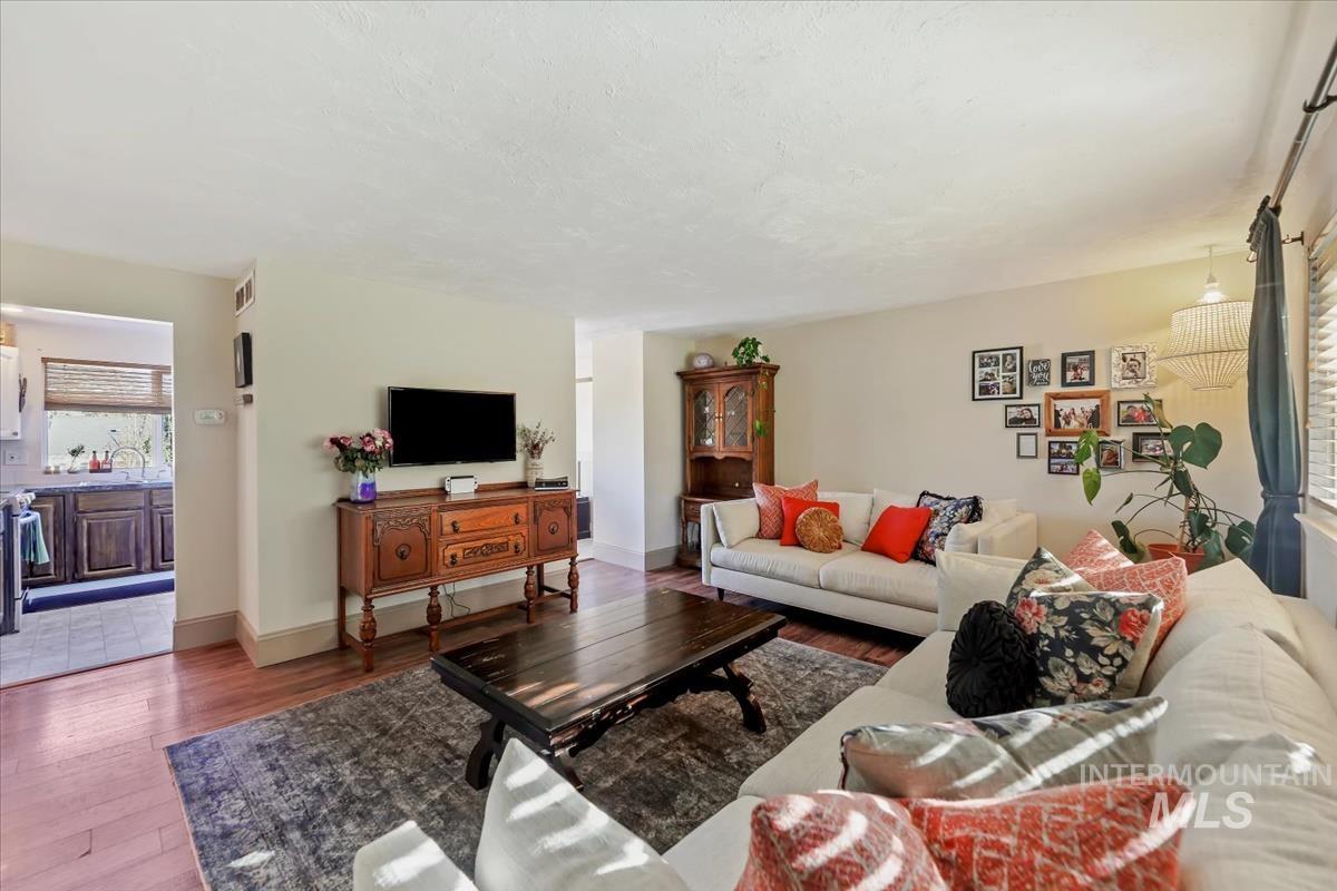 Living room with wood finished floors and baseboards