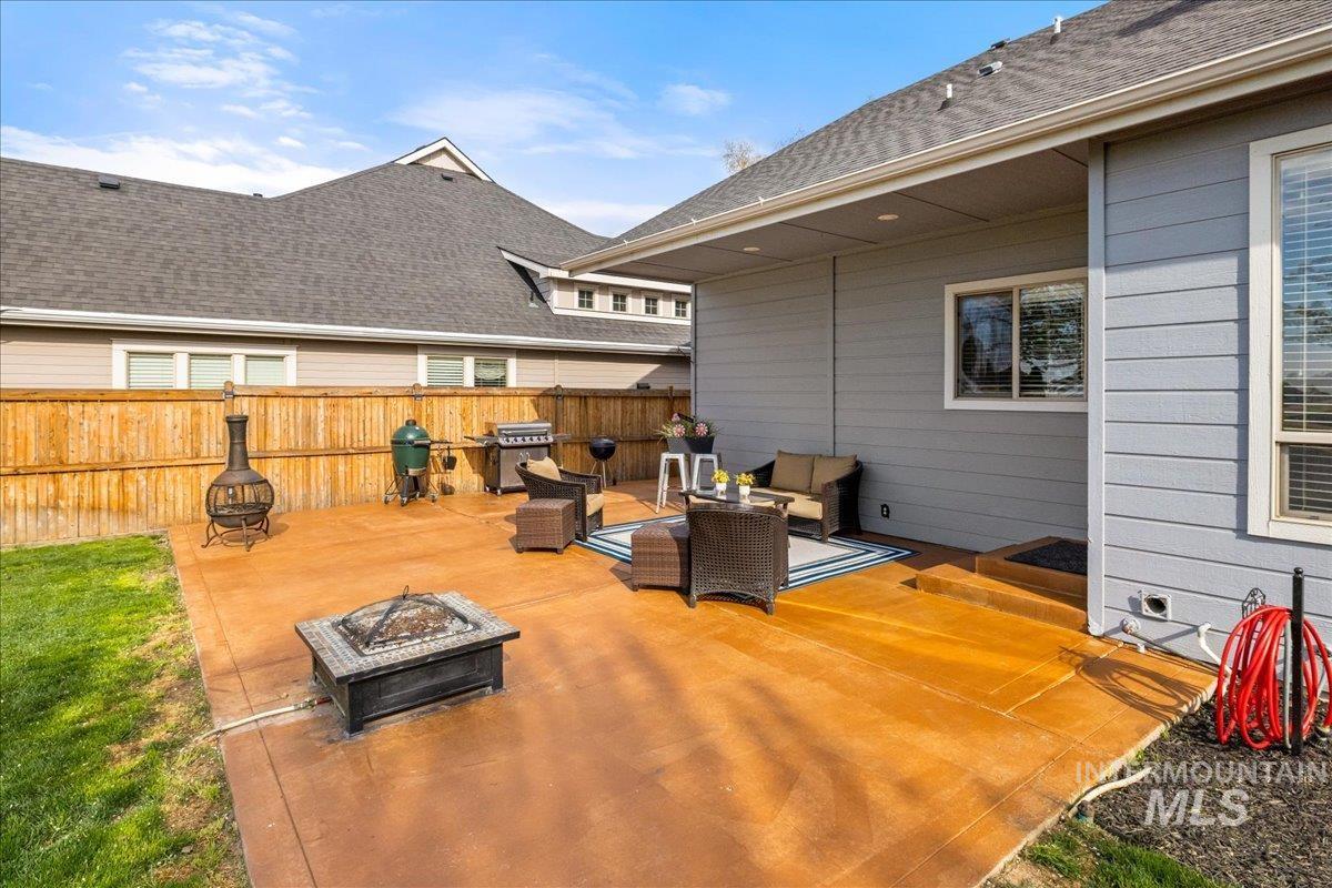 View of patio / terrace featuring grilling area and an outdoor living space with a fire pit