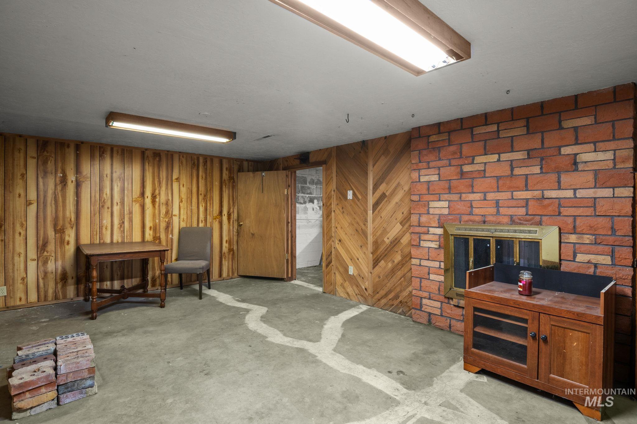Living area with unfinished concrete floors