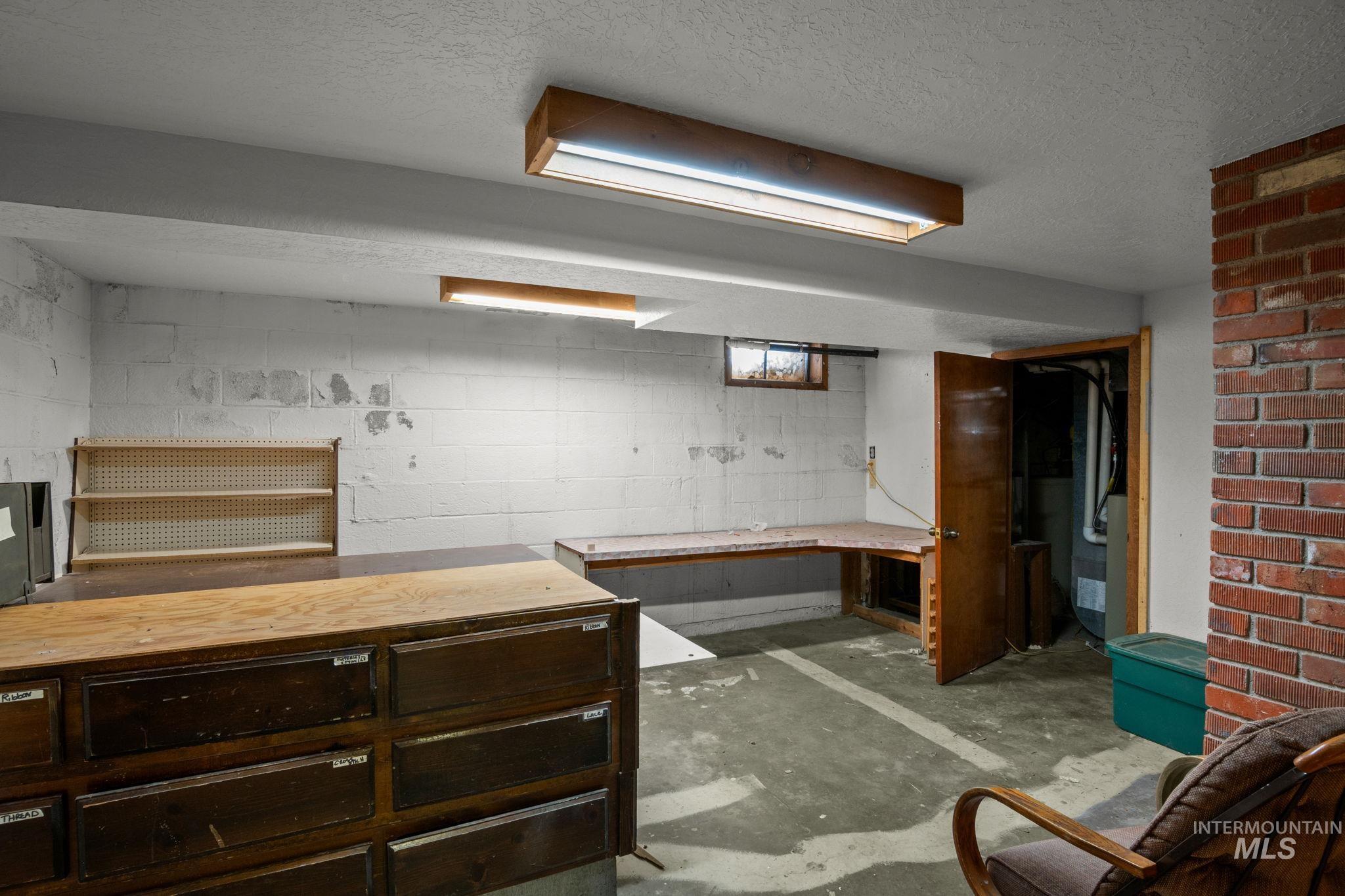 Basement with a textured ceiling