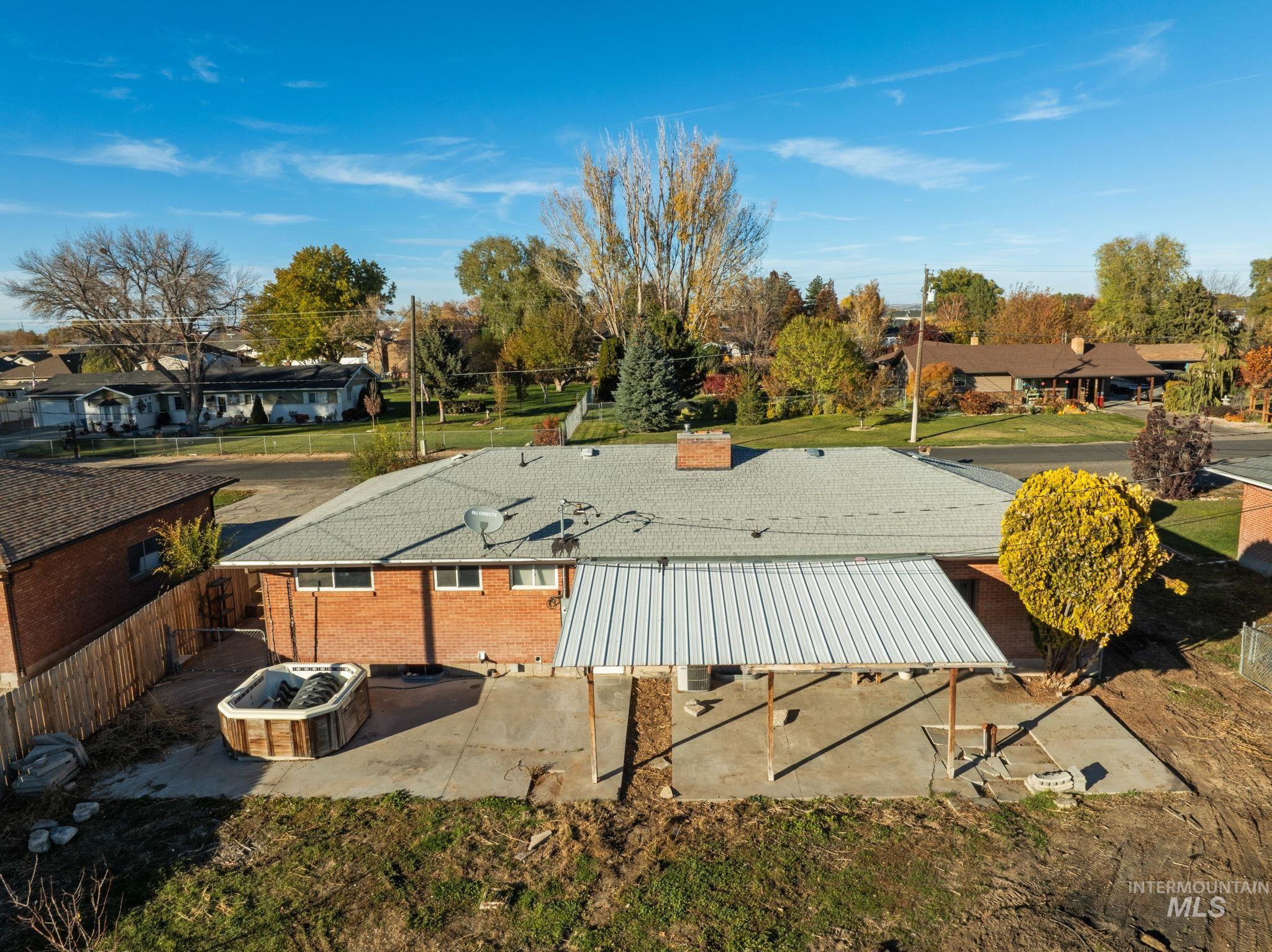 Back of house featuring a patio area and a residential view