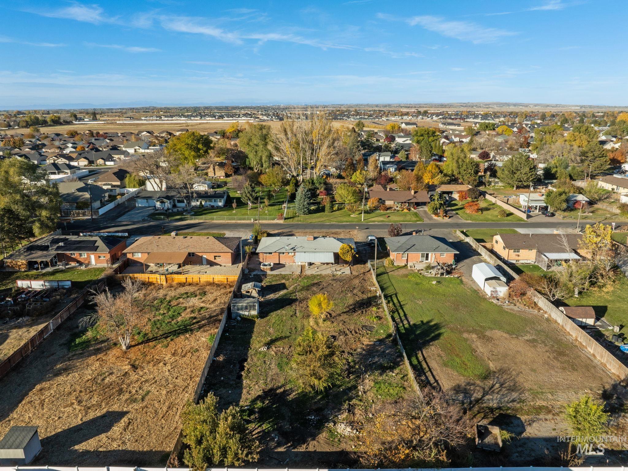 Aerial overview of property's location featuring nearby suburban area