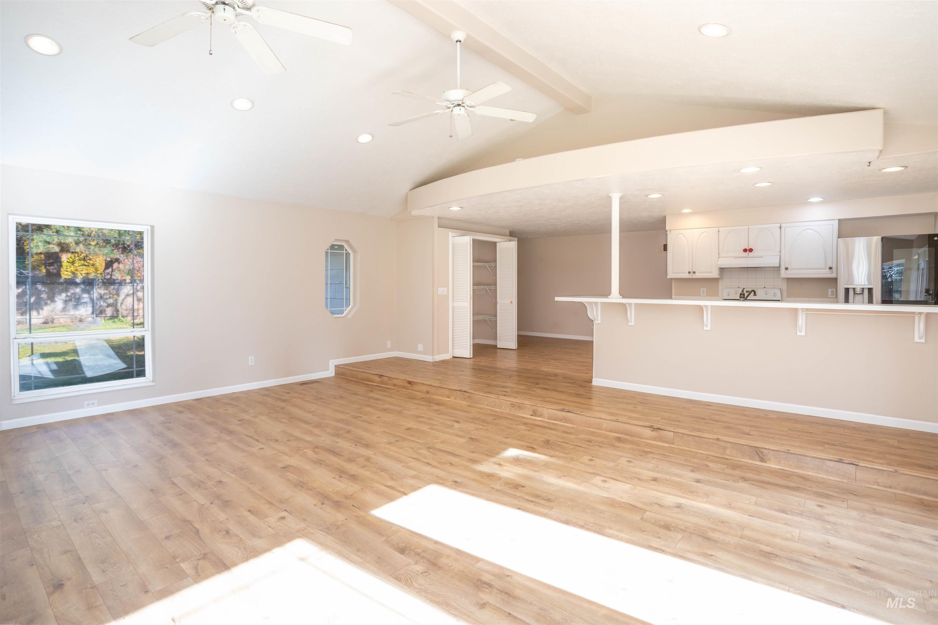 Unfurnished living room featuring recessed lighting, light wood-style floors, and ceiling fan