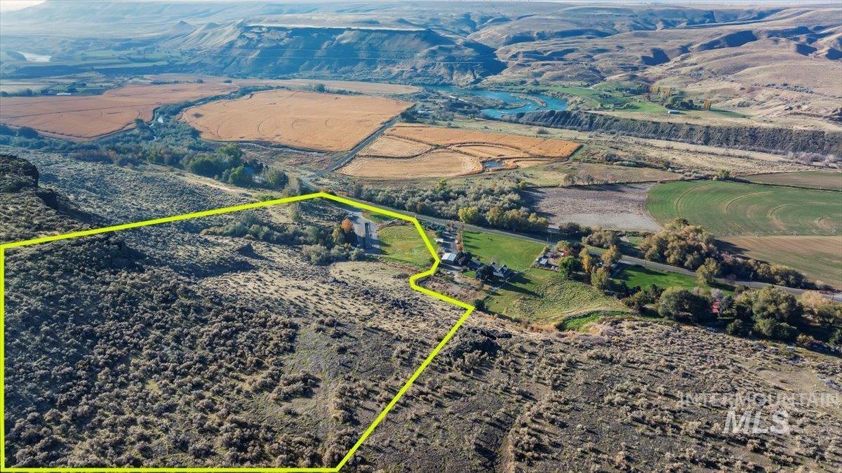 Aerial view of property and surrounding area with property boundaries highlighted