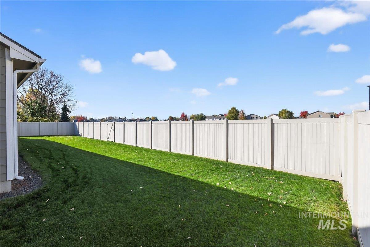 View of fenced backyard