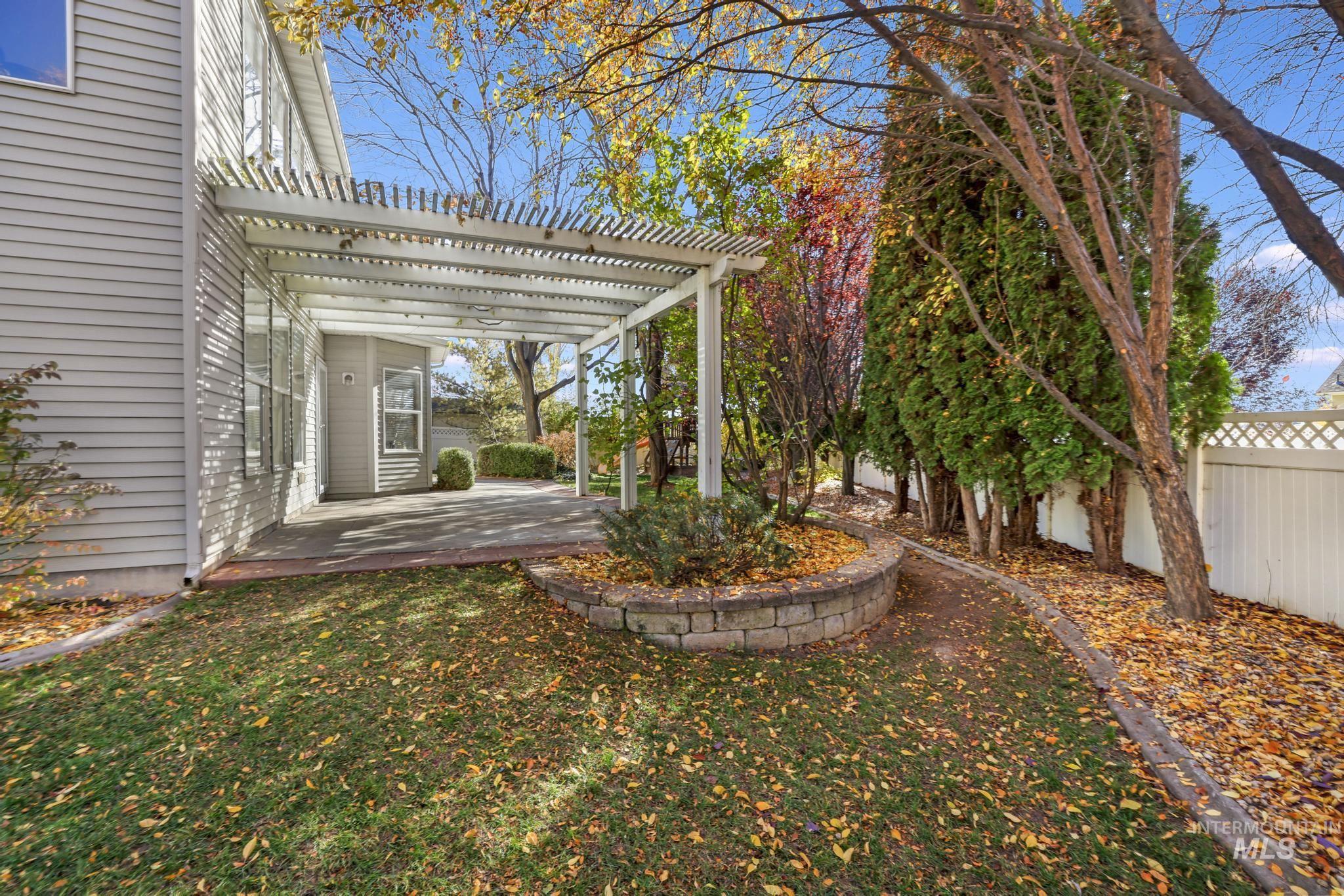 View of yard featuring a pergola and a patio