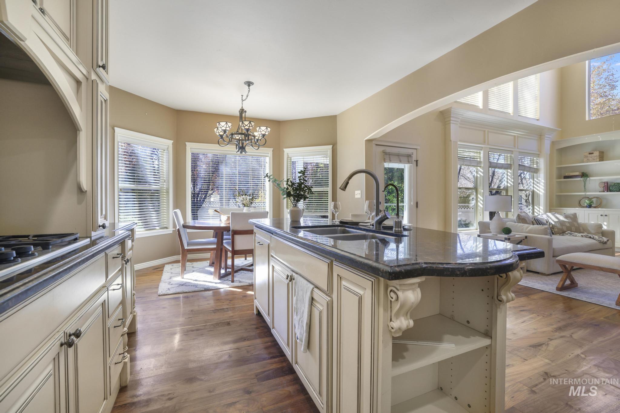 Kitchen with custom cabinets, walnut hardwood floors,  and an amazing amount of natural light