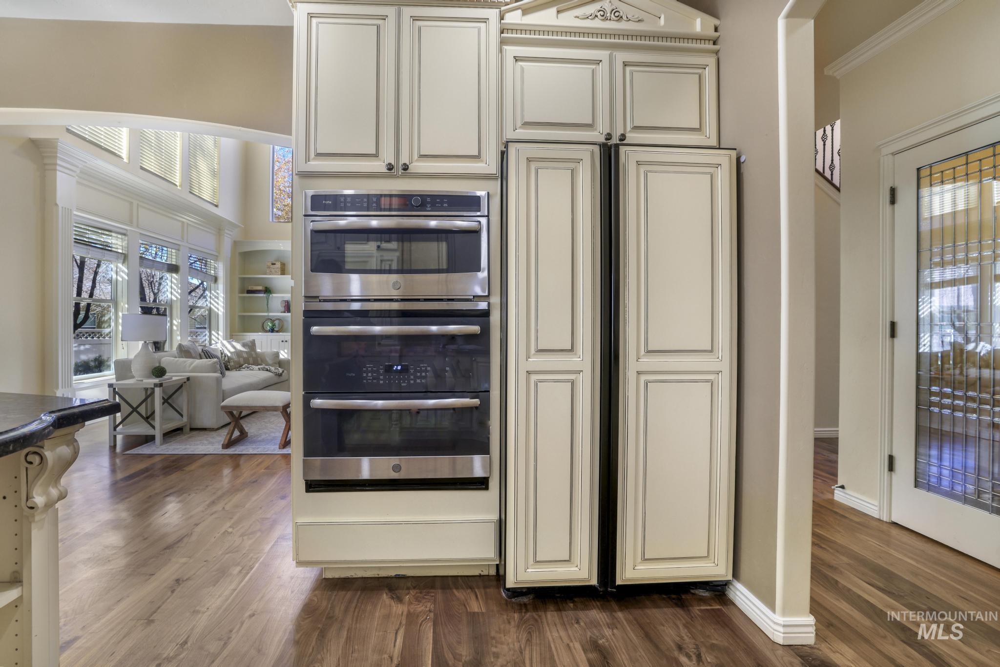 Kitchen with hidden paneled refrigerator and dishwasher,  Double oven, built-in microwave