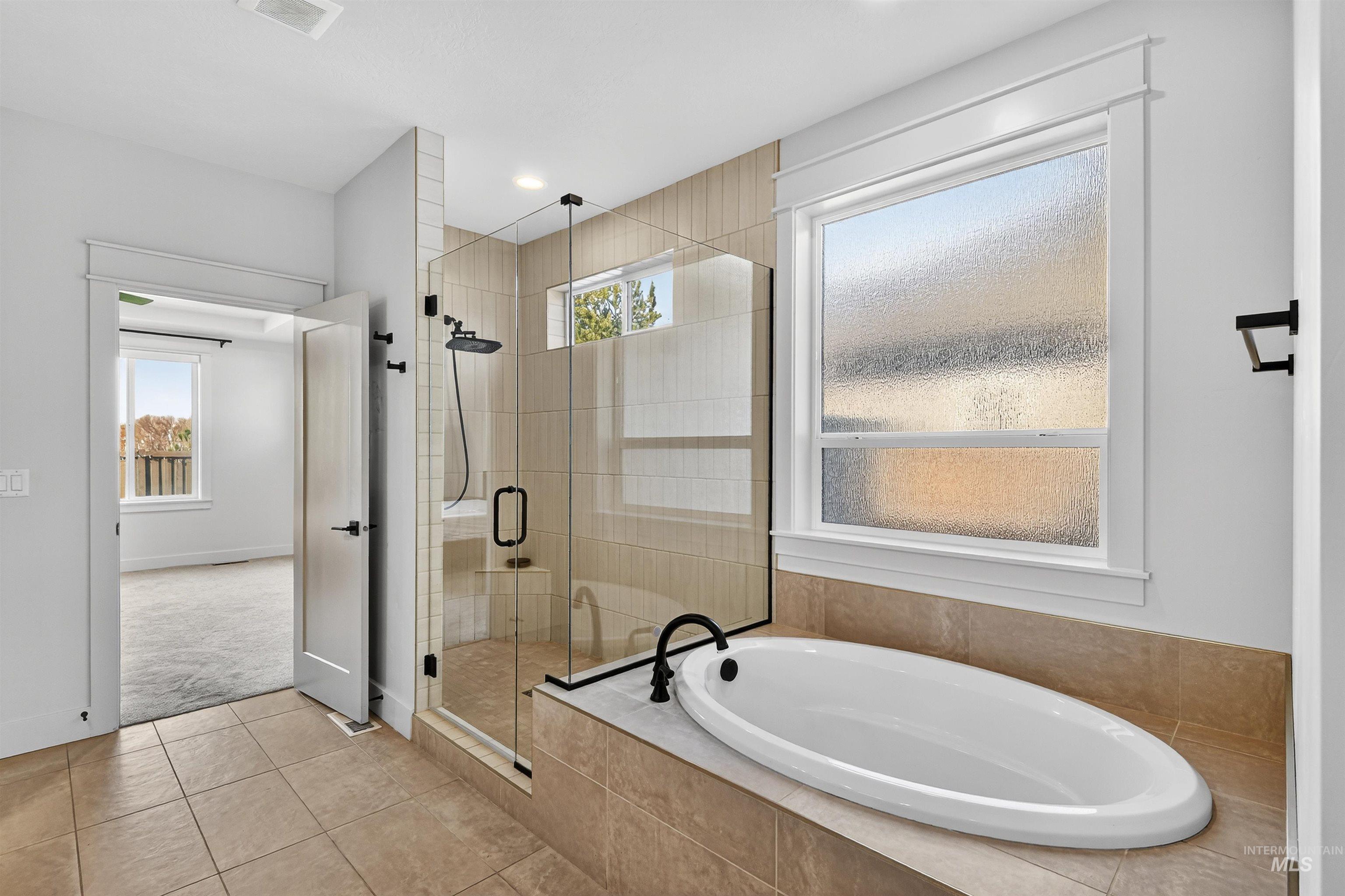 Full bath with a bath, tile patterned flooring, a stall shower, and recessed lighting