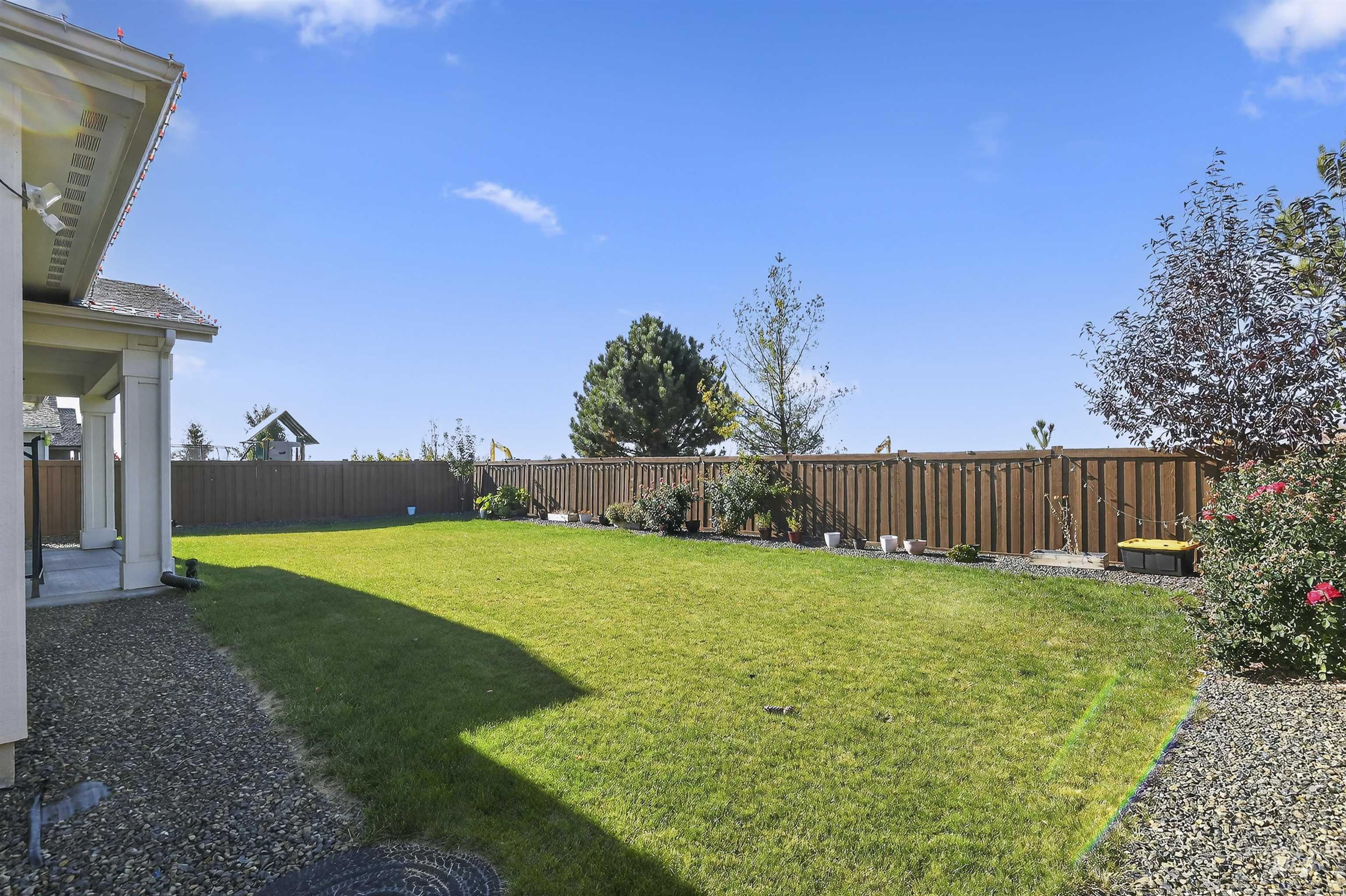 Fenced backyard with a patio