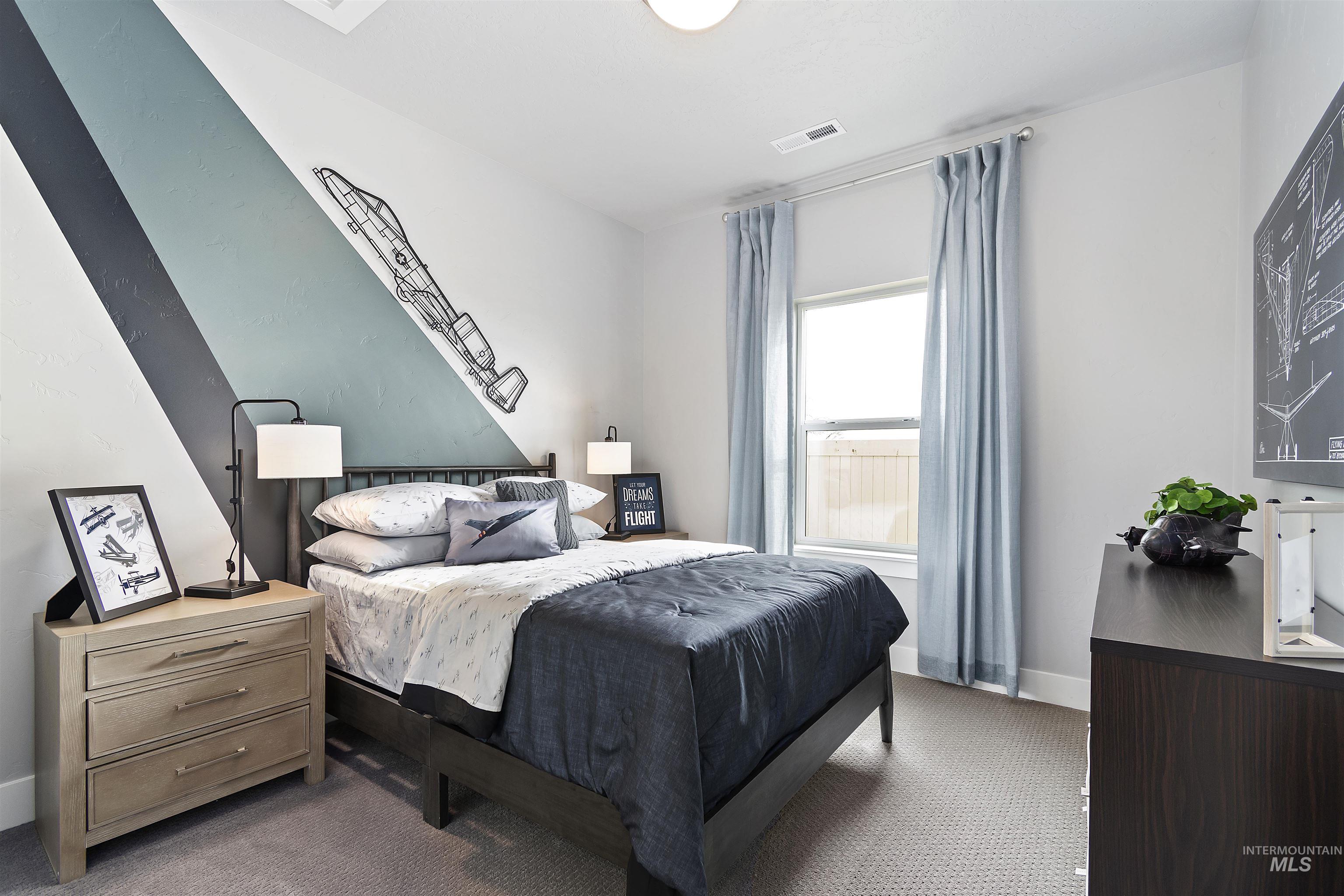 Carpeted bedroom with baseboards