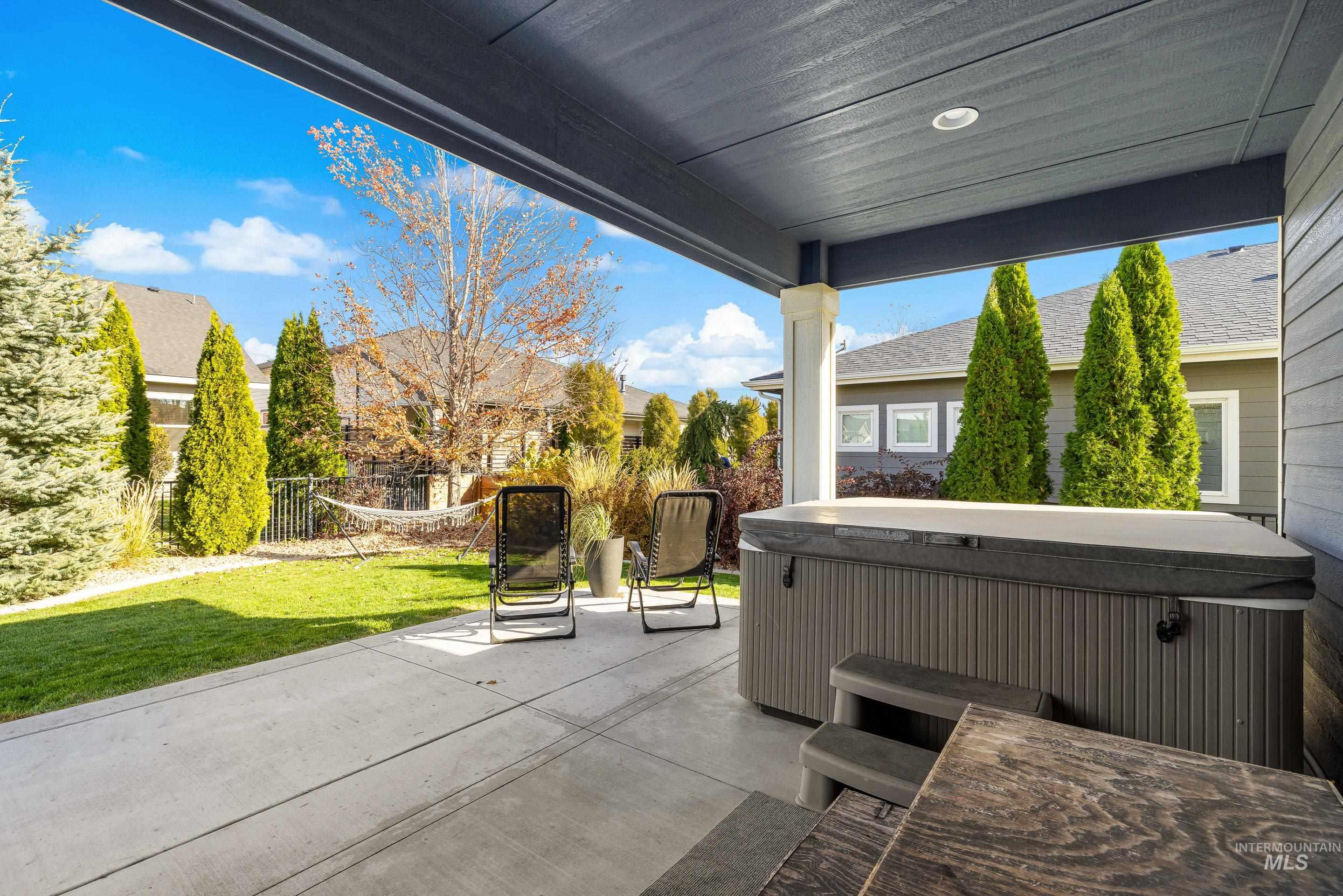 View of patio featuring a hot tub