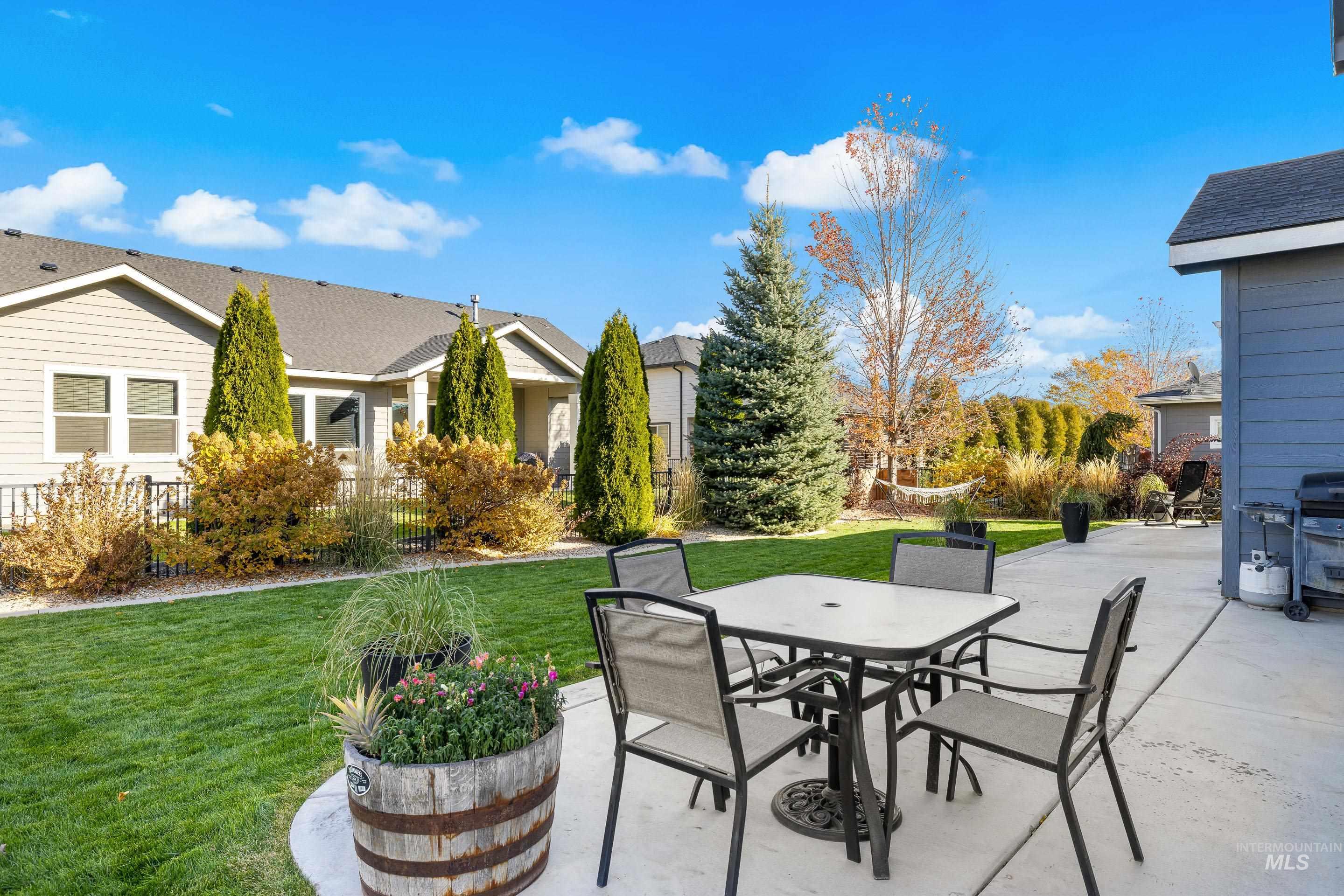 View of patio featuring area for grilling and outdoor dining area