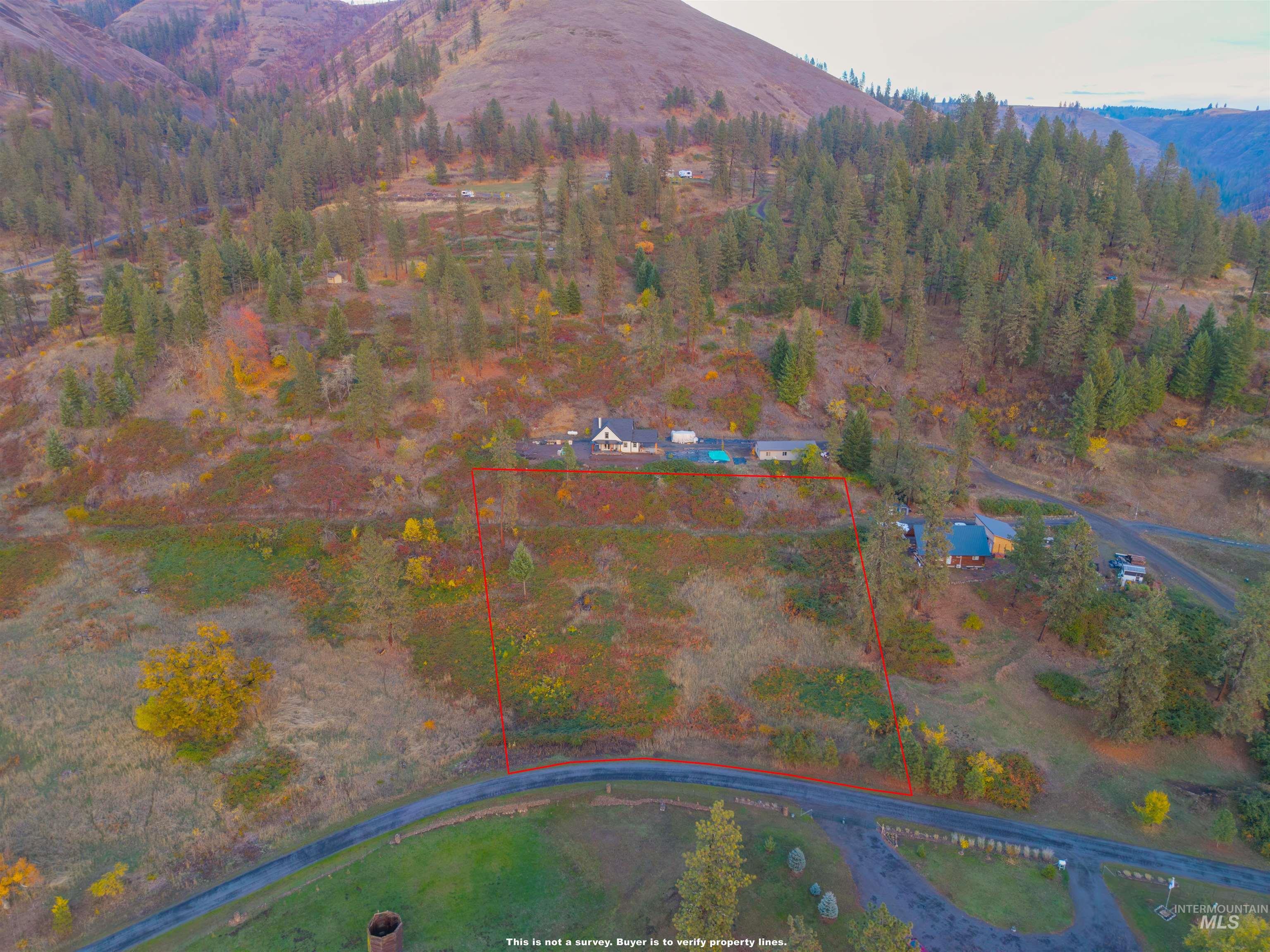 View of property location featuring a mountainous background and property parcel outlined