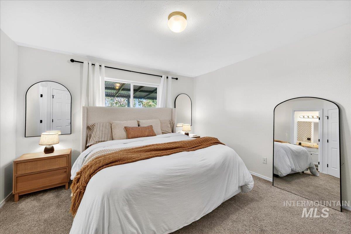 Carpeted bedroom with baseboards