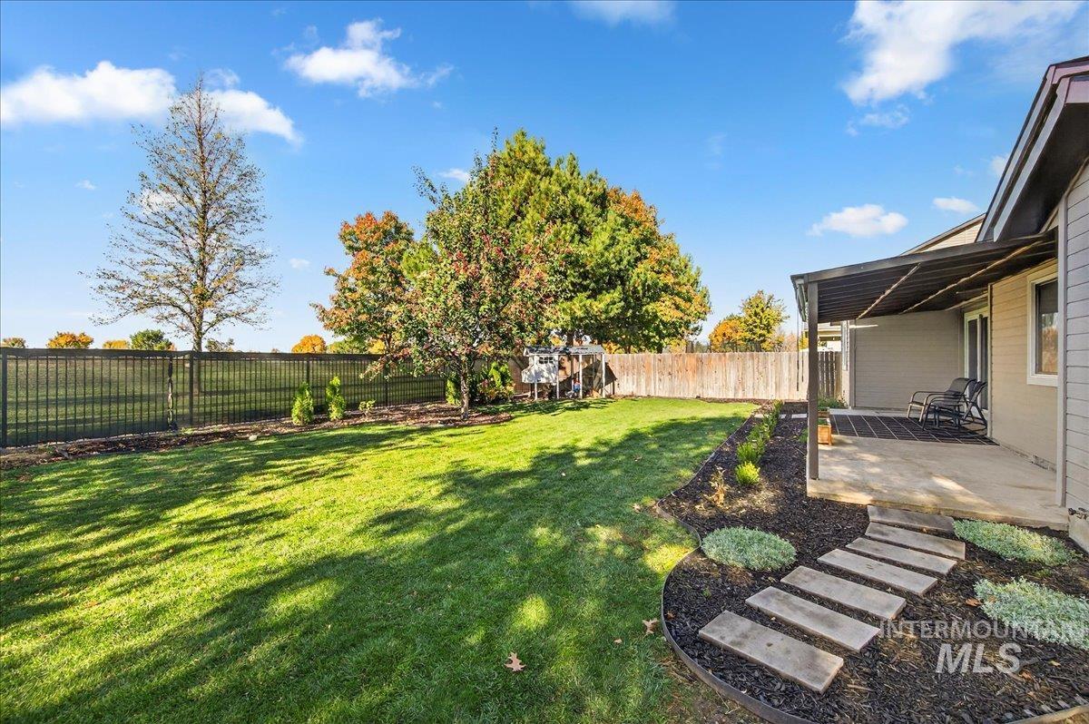 Fenced backyard featuring a patio area