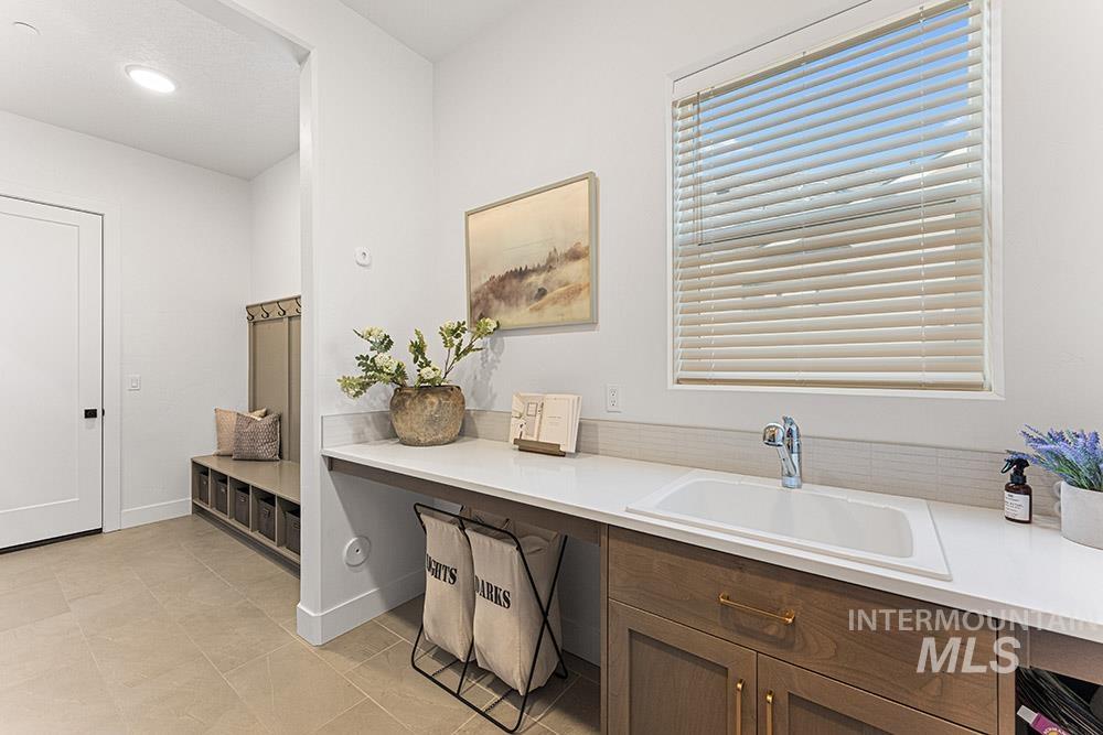 Office area with light tile patterned floors and recessed lighting