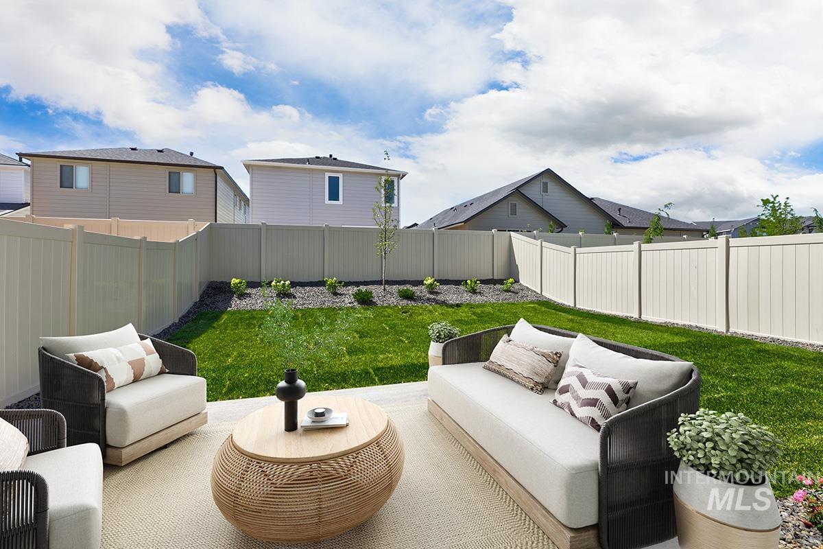 Fenced backyard with outdoor lounge area, a residential view, and a patio area