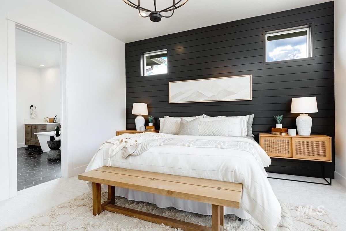 Bedroom with wood walls
