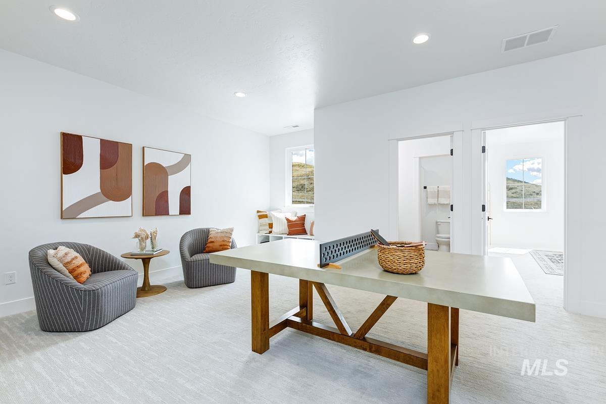 Recreation room featuring recessed lighting and light colored carpet
