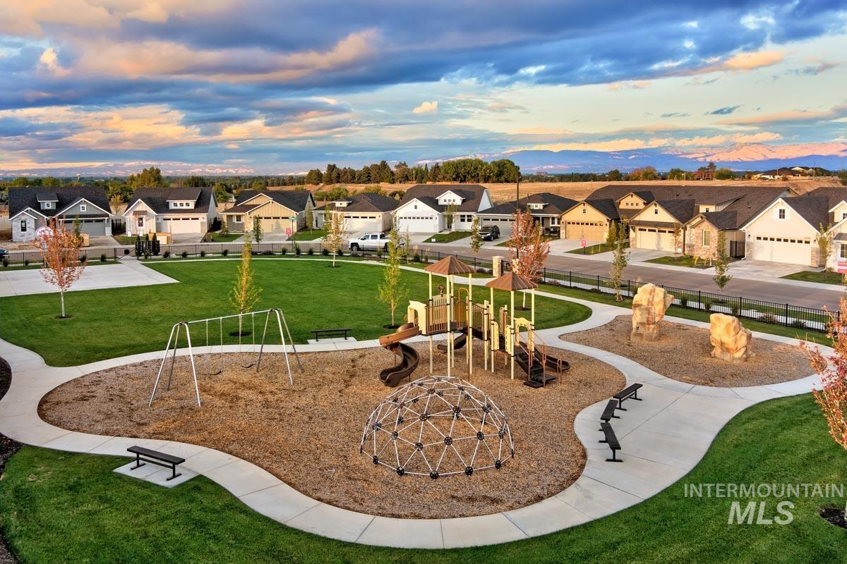 Surrounding community featuring a lawn and a residential view