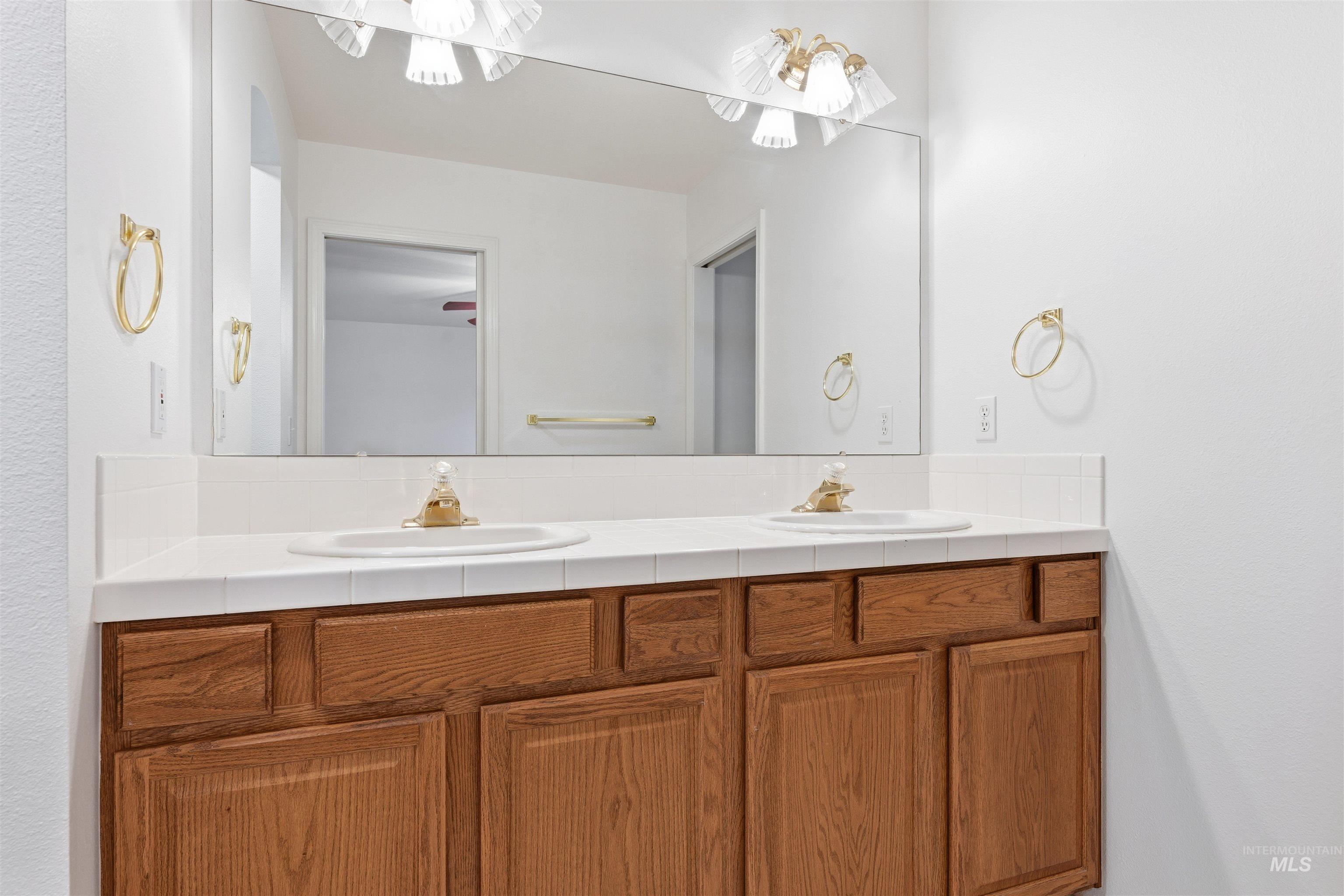 Full bathroom featuring double vanity