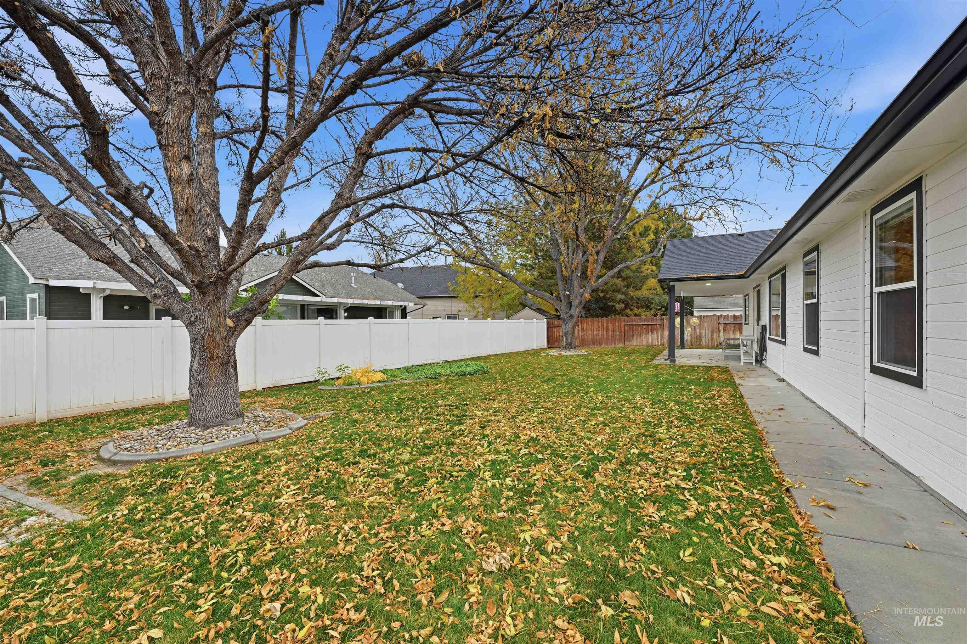 Fenced backyard featuring a patio