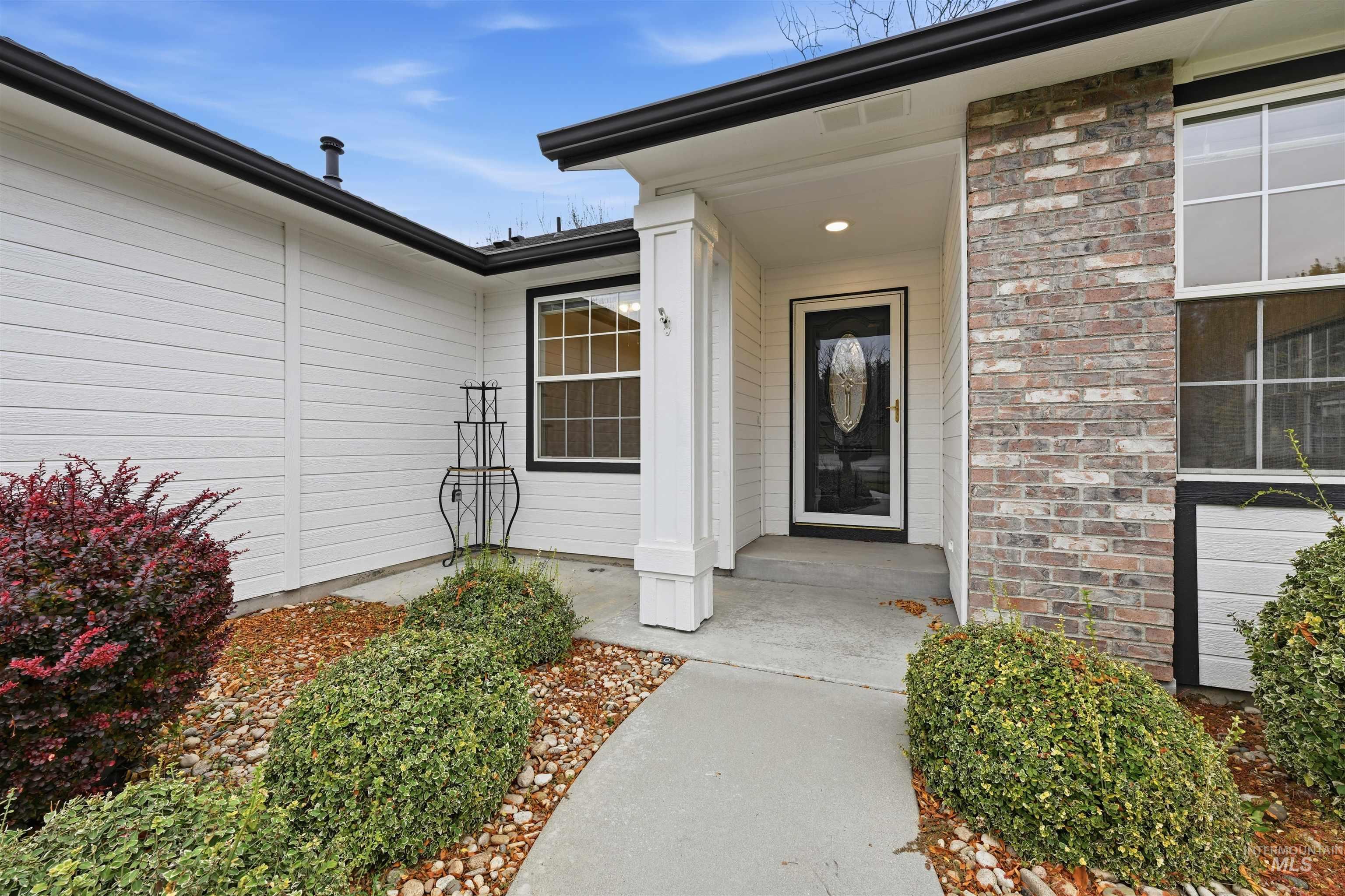Doorway to property with brick siding