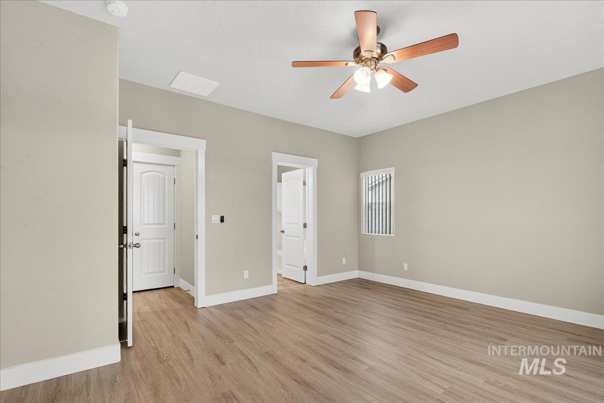 Unfurnished bedroom with light wood-style flooring and a ceiling fan