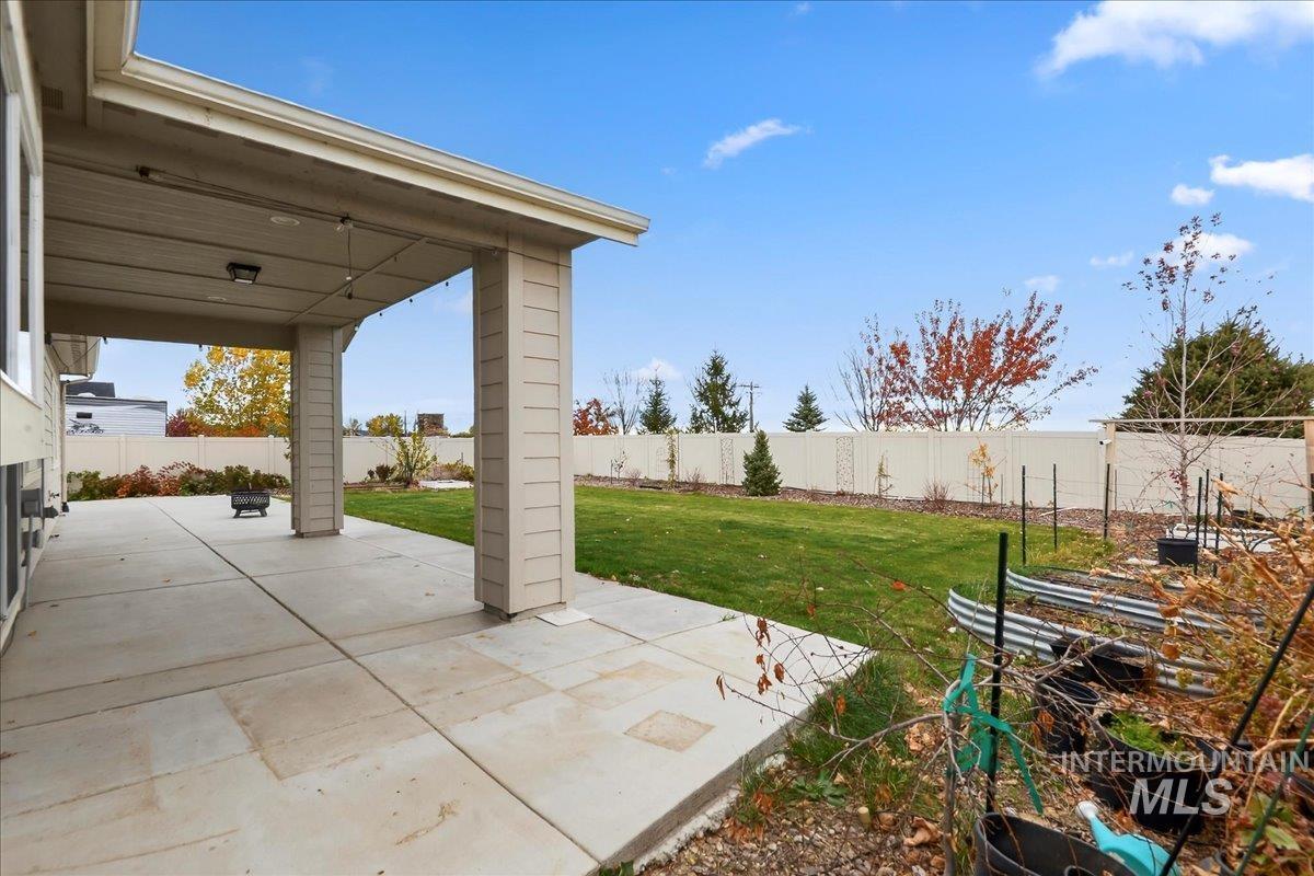 Fenced backyard featuring a patio area