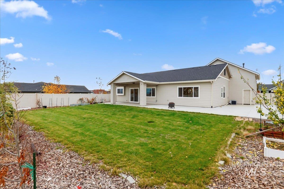 Back of house with a patio and a fenced backyard
